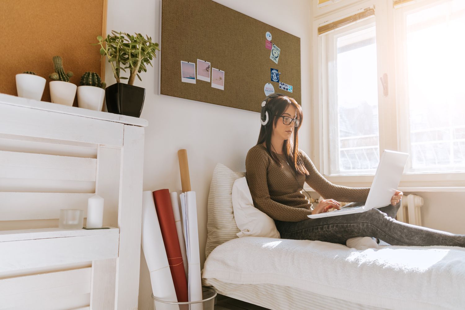 lady doing homework with a fabricmate tackboard panel behind her