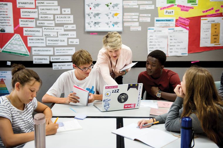 teaching students in classroom with acoustic and tackable wall covering