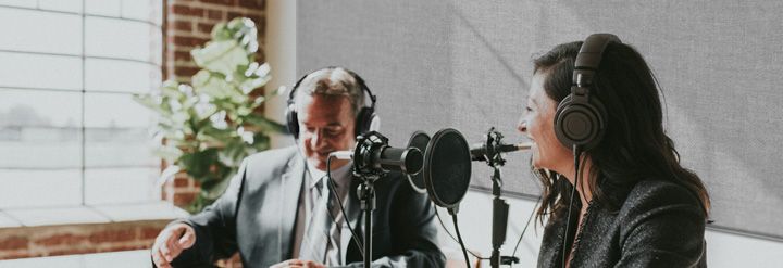 A broadcasting team with sound absorbing panels