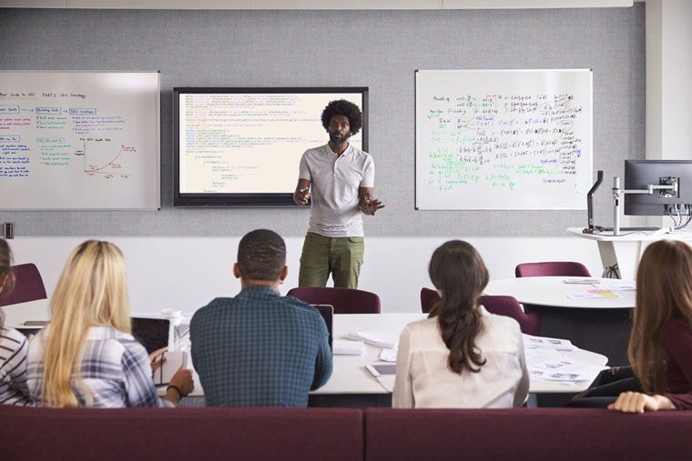 single band tackable and acoustic fabric covered panel in classroom 