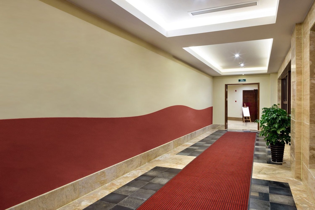 24. Hotel Hallway with a Single Band Curved Stretched Fabric Wainscoting-System as Wall Protection